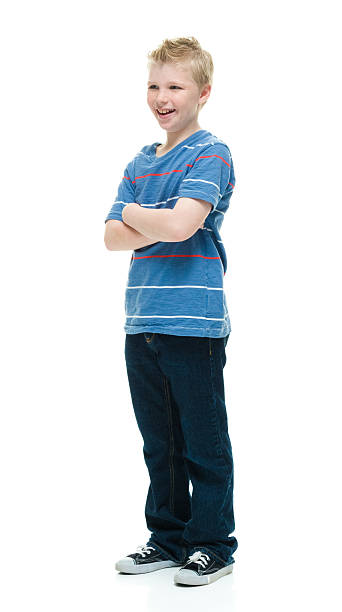 istock Smiling little boy standing with arms crossed 507455260
