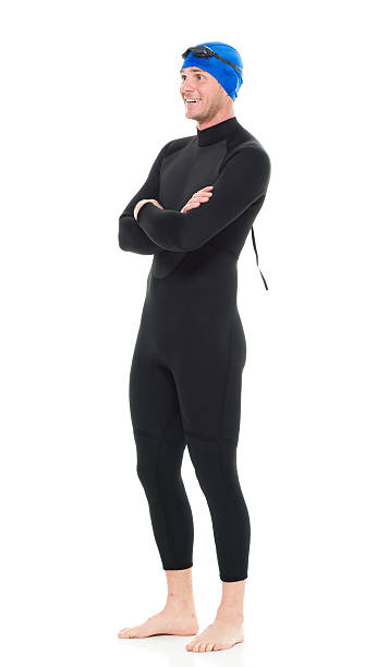 istock Smiling swimmer standing with arms crossed 507455546