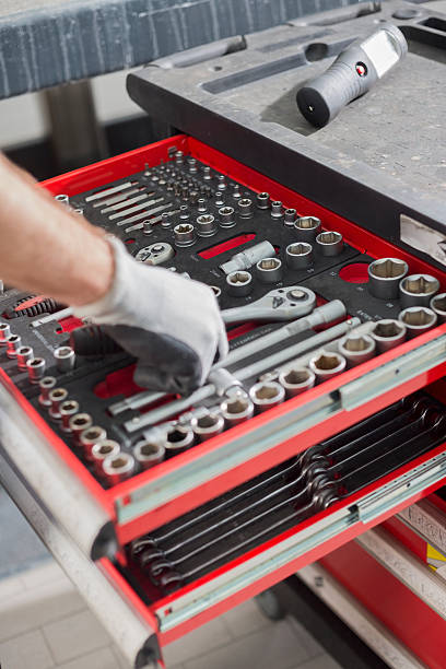 istock Cropped image of male mechanic taking tool from drawer 507455979