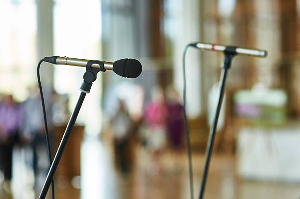 istock microphone against the background of convention center 507456170