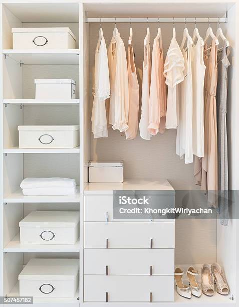 White Wardrobe On Wooden Floor With Dress Stock Photo - Download Image Now - Closet, Coathanger, Arts Culture and Entertainment