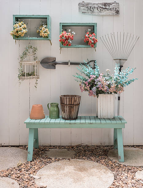 istock flower on green bench with white wood panel wall 507457232