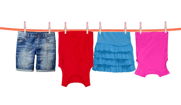 istock Laundry line with clothes isolated on white background 507457422