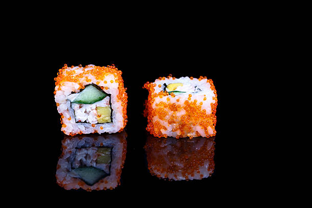 istock Traditional California roll on a black mirror. 507459400