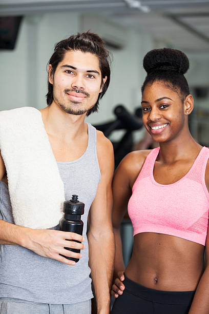 istock Couple In The Gym Standing Together And Looking At Camera 507459784