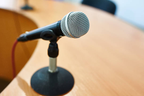istock microphone against the background of convention center 507459918