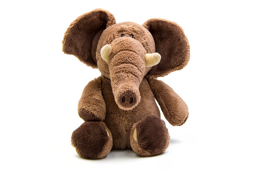 Brown elephant soft toy isolated on white.