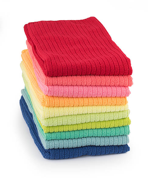 istock Pile of new coloful microfibre cloths on white 507462086