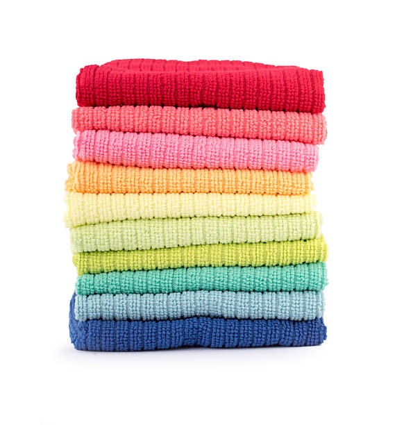 istock Pile of new coloful microfibre cloths on white 507462122