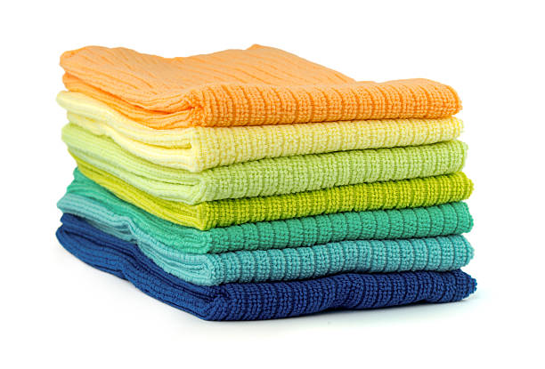 istock Pile of new coloful microfibre cloths on white 507462160