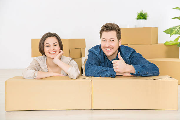 istock Happy couple sitting on the floor 507473928