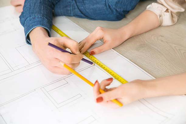 istock Happy couple drawing plan of their flat 507474054