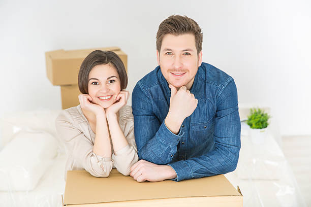 istock Positive couple leaning on the boxes 507474558