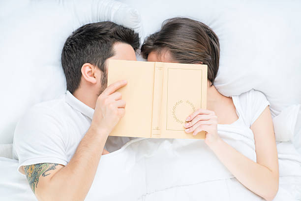 istock Nice loving couple lying in bed 507475294