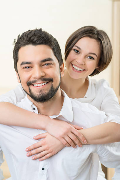 istock Handsome man holding wife on the back 507475742