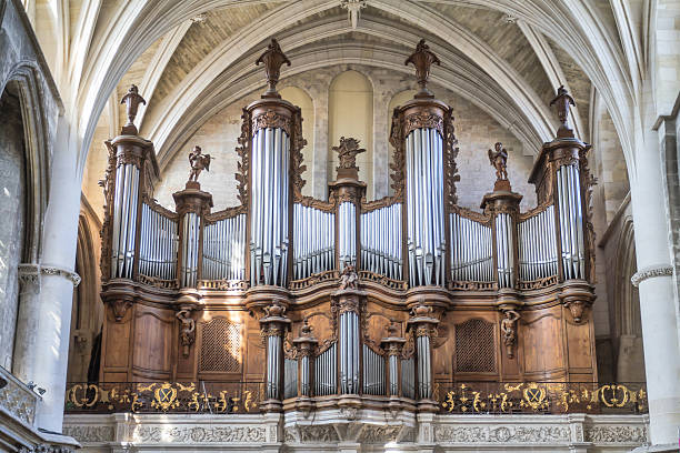 Bordeaux - Pipe organ of Cathédrale Saint-André Bordeaux,  France - August 24, 2015: Pipe organ of  Bordeaux Cathedral (Cathédrale Saint-André de Bordeaux) is a Roman Catholic cathedral, seat of the Archbishop of Bordeaux-Bazas. The cathedral was consecrated by Pope Urban II in 1096. Of the original Romanesque edifice, only a wall in the nave remains. The Royal Gate is from the early 13th century, while the rest of the construction is mostly from the 14th-15th centuries. The building is a national monument of France. hurdy gurdy stock pictures, royalty-free photos & images