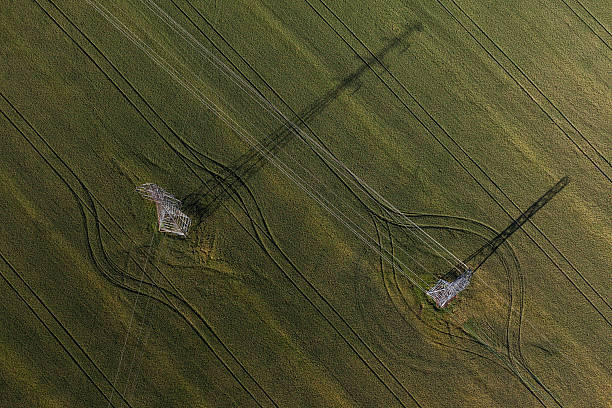 istock aerial view of  the electric tower on harvest fields 507478440
