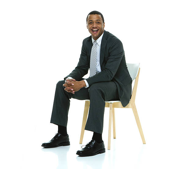istock Smiling businessman sitting on chair 507478778