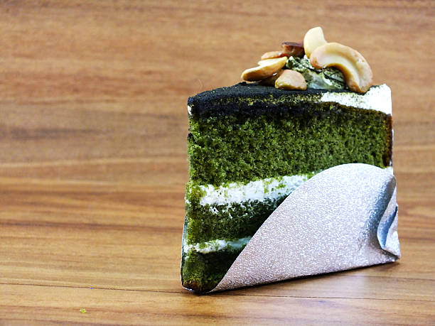 green tea layer cake on wooden background