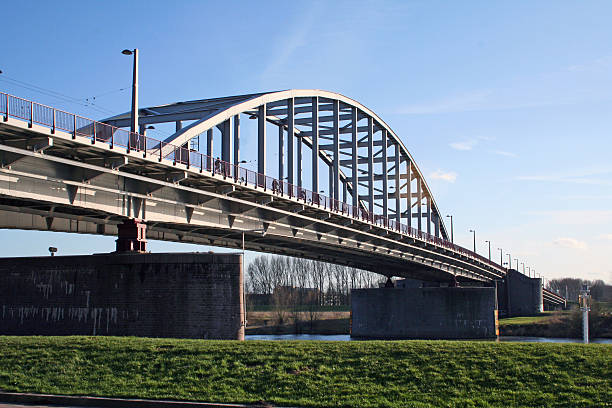 Arnhem, Netherlands - March 24, 2009: John Frost Bridge (John Frostbrug), named after Major-General John Dutton Frost who led the British forces that reached and defended the bridge during the Battle of Arnhem in September 1944, and made famous by A Bridge Too Far.