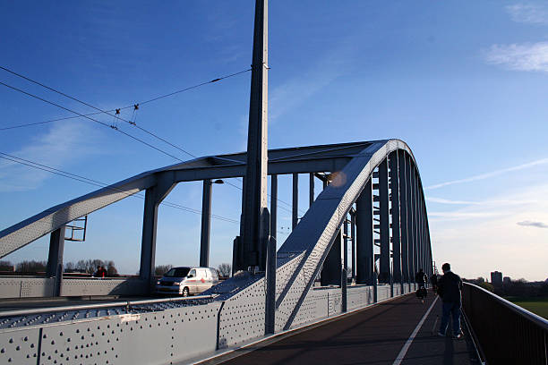 Netherlands: John Frost Bridge (John Frostbrug) in Arnhem Arnhem, Netherlands - March 24, 2009: John Frost Bridge (John Frostbrug), named after Major-General John Dutton Frost who led the British forces that reached and defended the bridge during the Battle of Arnhem in September 1944, and made famous by A Bridge Too Far. operation market garden stock pictures, royalty-free photos & images