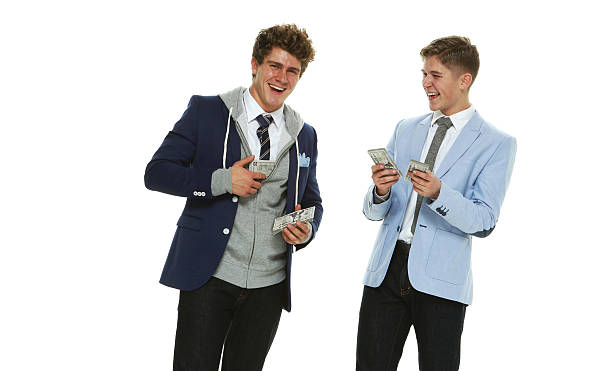istock Smiling smart casual men holding money 507492268