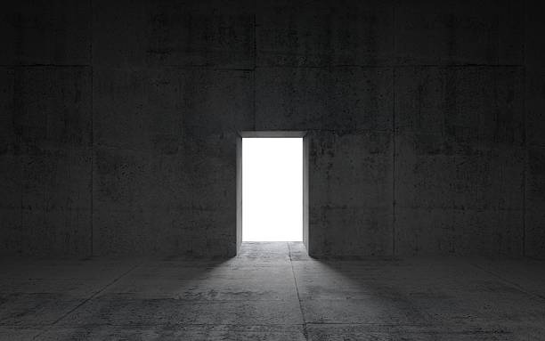 istock Abstract dark concrete interior with glowing door, 3d illustrati 507492473