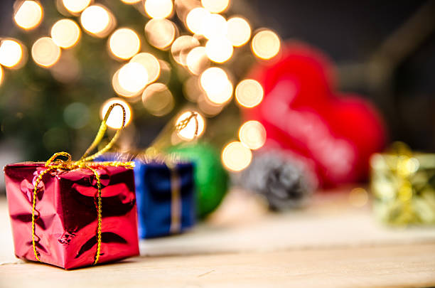 christmas gift box decor on light backgrond process in coss color tone