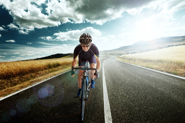 istock Bicycle Rider pedaling on a Country Highway 507493185