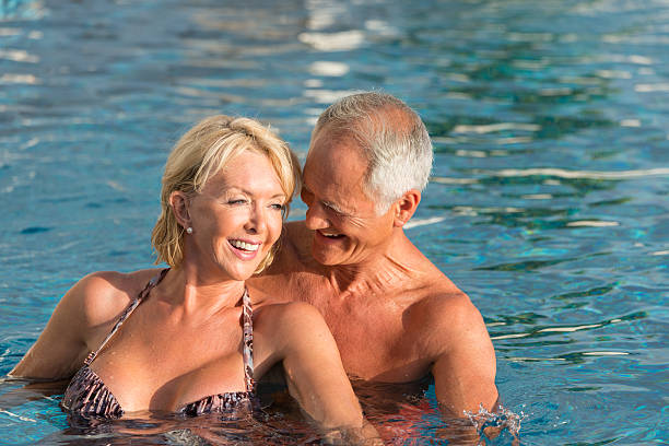 istock Senior Couple In The Swimming Pool 507493323