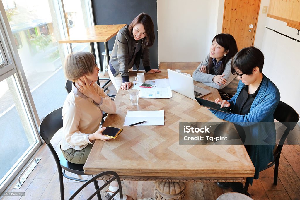Business women in a meeting room Business women in a meeting enjoy the discussion the business strategy at the meeeting. Business Meeting Stock Photo
