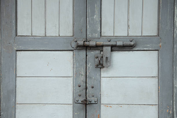 istock Grey wooden door with a bolt 507494352