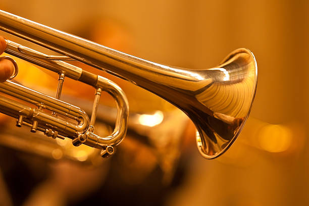 Detail of the trumpet closeup Detail of the trumpet closeup in golden tones trumpet stock pictures, royalty-free photos & images