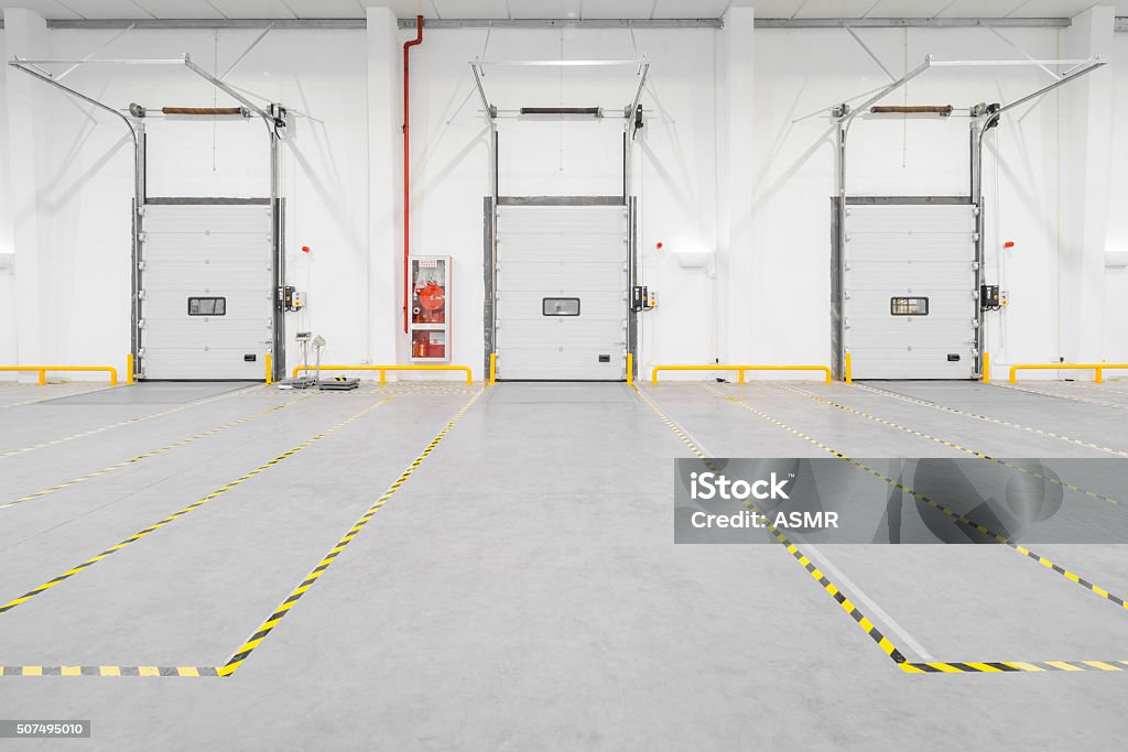 Inside a large empty new warehouse Indoors Stock Photo