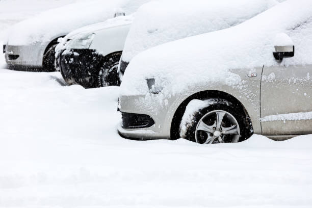 istock snow-covered cars in parking lot 507495928