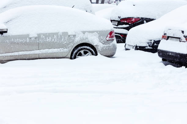 istock parked cars covered with snow 507496094