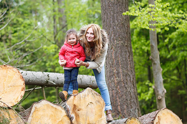 istock Mother and child outdoors playing, kissing and hugging 507496428