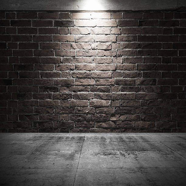 istock Concrete floor and brick wall with spot light illumination 507499174