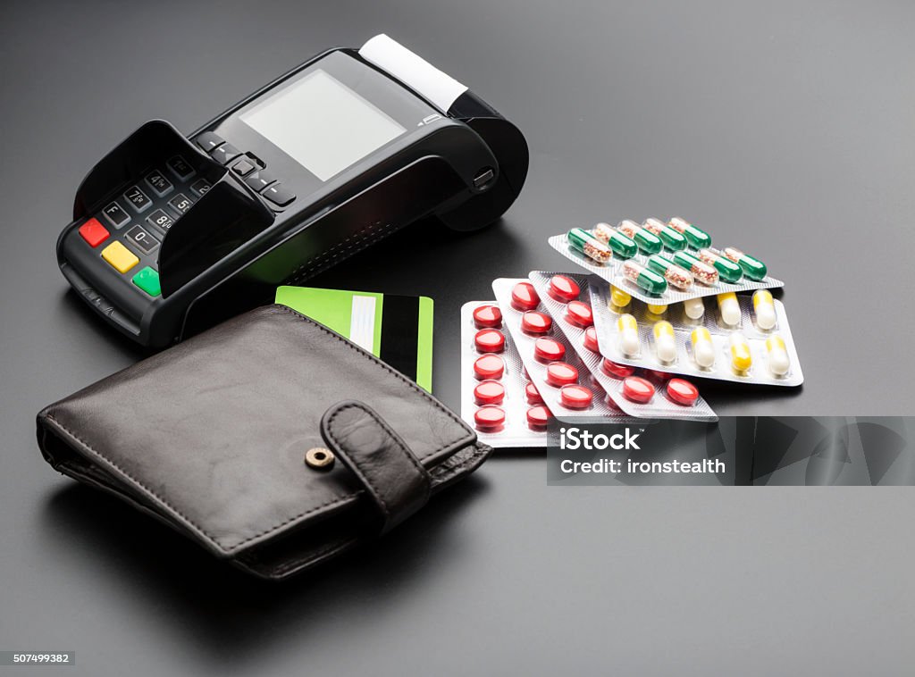 POS terminal, credit card and pill blister packs POS terminal, debit card and pill blister packs over white Addiction Stock Photo