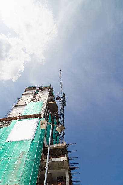 istock Tower crane  on buildings under construction with protective saf 507500736