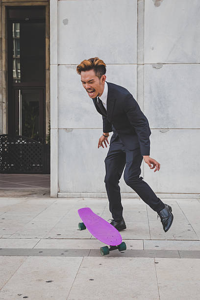 istock Young handsome Asian model jumping with his skateboard 507500752