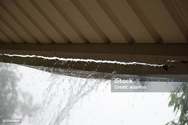 Broken Gutter With Rain Pouring Through Stock Photo - Download Image Now - Accidents and Disasters, Aluminum, Architectural Feature