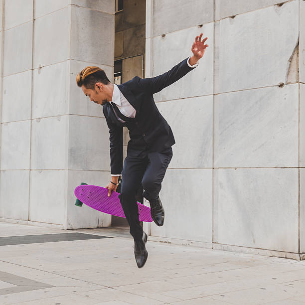 istock Young handsome Asian model jumping with his skateboard 507500912