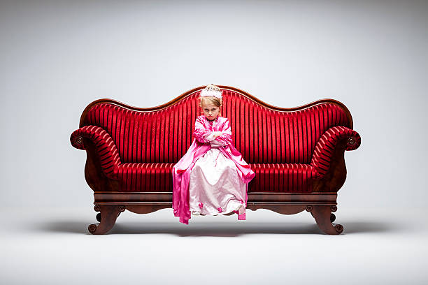 istock Angry Princess - Humor Child Sofa offended 507511271