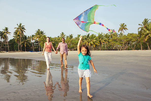 istock Mixed race family having rest on the beach 507511866