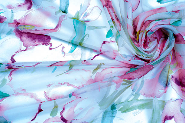 istock Fabric silk texture, painted with flowers 507515948