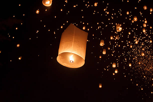 Floating asian lanterns in Chiang Mai Thailand Floating asian lanterns in Yee-Peng festival ,Chiang Mai Thailand krathong stock pictures, royalty-free photos & images