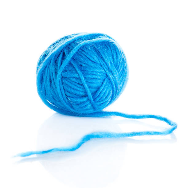 istock Blue wool yarn ball isolated on white 507516889
