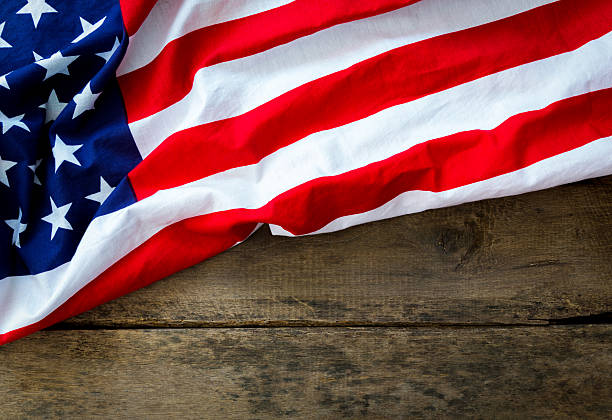 istock American flag on wood background 507517215