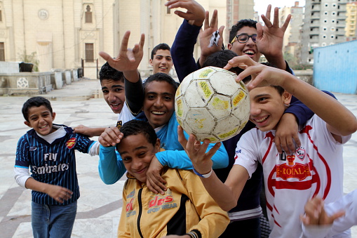 Alexandria, Egypt - December 14, 2012: Young Boys playing Football in Egypt